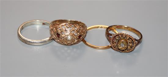 A yellow metal and diamond set ring, a 22ct gold band, a 9ct ring and a silver ring.